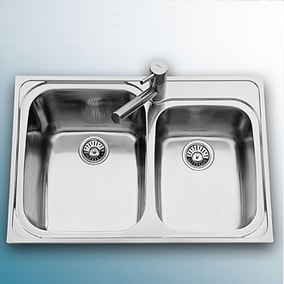 Stainless steel double-bowl kitchen sink with single-lever faucet installed by Persis Plumbing